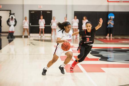 Jada Perkins dribbles down the court during the homecoming game. - Photo by Kristi McMurry Woody