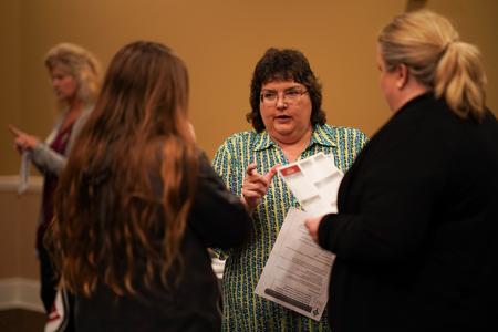 Sheilla Foster, assistant professor of nursing, talks with prospective students during the department fair at Day at the U. - Photo by Kristi McMurry Woody