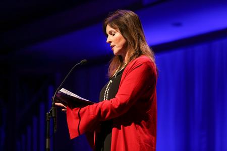 Fran Thomas, special events/visit coordinator, reads scripture during A Union Christmas.  - Photo by Kristi McMurry Woody