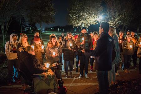 Students sing Christmas songs near the Great Lawn before lighting the outdoor Christmas tree. - Photo by Kristi McMurry Woody