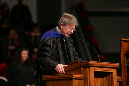 Mark Bolyard, university professor of biology and department chair, delivers the invocation during fall graduation. - Photo by Kristi McMurry Woody