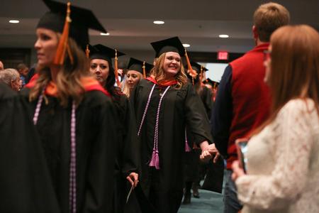 Graduates process into West Jackson Baptist Church's sanctuary for fall graduation. - Photo by Kristi McMurry Woody