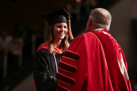 Bethany Hardison, master of science in nursing graduate, receives her diploma during fall graduation. - Photo by Kristi McMurry Woody