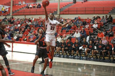 KC Goodwin goes up for a shot in a game against the AUM Warhawks. - Photo by Kristi McMurry Woody