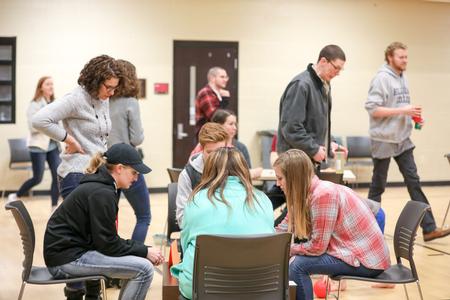 Erin Slater, resident director, watches as students play in the Res Life Bunco Tournament in the Bowld Student Commons. - Photo by Kristi McMurry Woody