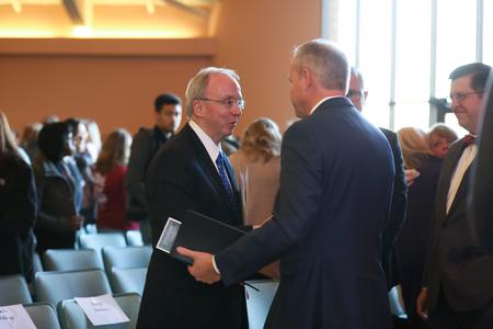 David S. Dockery and Dub Oliver, president of the university, shake hands after Founder's Day chapel.  - Photo by Kristi McMurry Woody