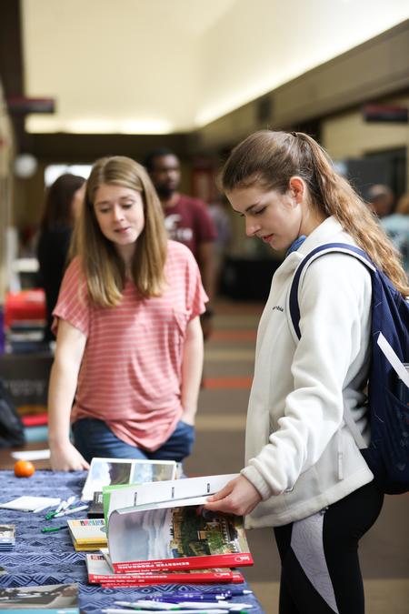 Students look at materials for different opportunities during the External Study Fair. - Photo by Kristi McMurry Woody