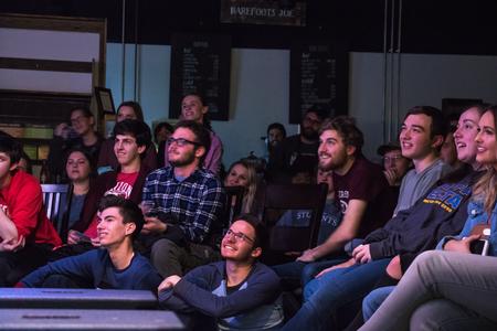 Students and guests of Scholars of Excellence weekend enjoy the Blank Slate Improv show in Barefoots Joe. - Photo by Janelle Vest