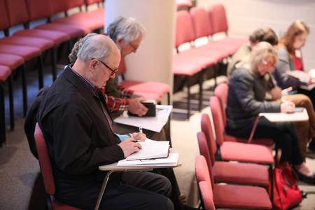 Attendees of the Spring Bible Conference at Union University take notes during a parallel session in Hartley Recital Hall. - Photo by Kristi McMurry Woody