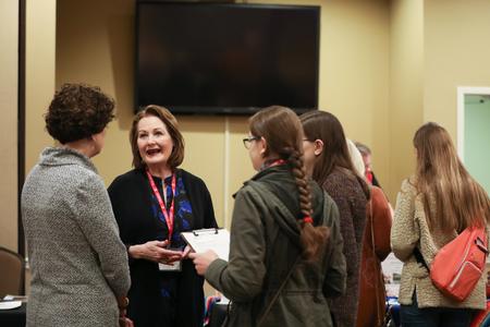 Jean Marie Walls, professor of language and department chair, chats with prospective students and their families during Day at the U. - Photo by Kristi McMurry Woody