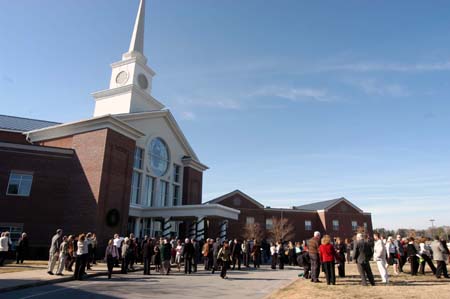 Family and friends enjoyed the unusually warm weather with their graduates shortly after fall graduation at West Jackson Baptist Church. - Photo by Morris Abernathy