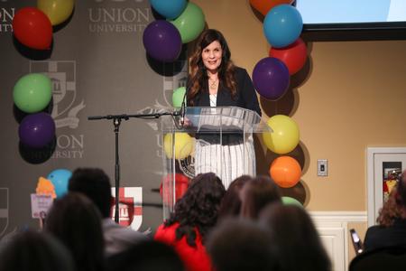 Susie Oliver, first lady of the university, welcomes guests to the annual Auxiliary Banquet. - Photo by Kristi McMurry Woody