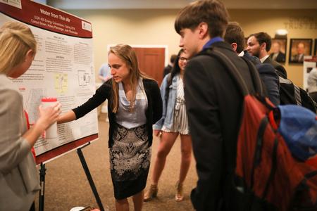Carson Brown, engineering major, explains her research project during the Scholarship Symposium. - Photo by Kristi McMurry Woody