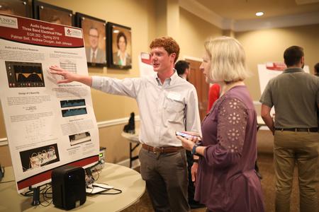 Palmer Bell, engineering major, presents his project at the Scholarship Symposium. - Photo by Kristi McMurry Woody