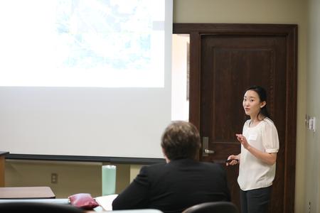 Yee Eun Lee, cell and molecular biology major, presents her research at the Scholarship Symposium. - Photo by Kristi McMurry Woody