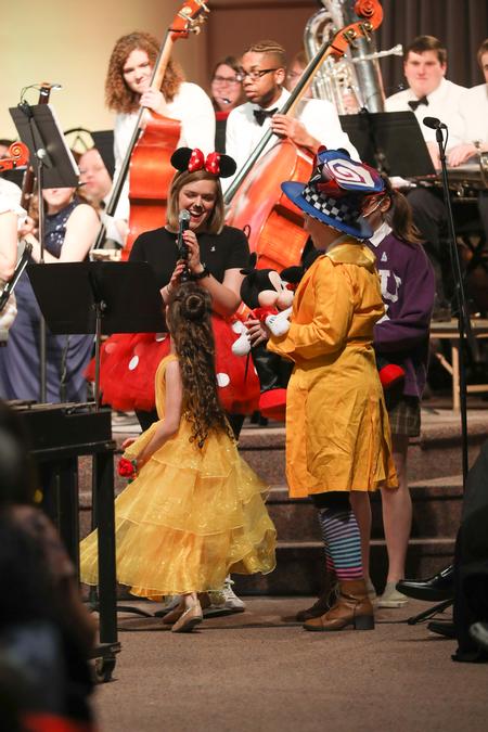 Amiee Brassart, assistant director for student leadership and engagement, hands out prizes for the costume contest winners at "A Magical Night at Union." - Photo by Kristi McMurry Woody