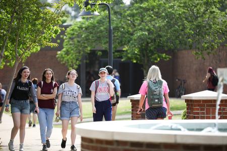 Students walk by the PAC fountain on their way to class.  - Photo by Kristi McMurry Woody