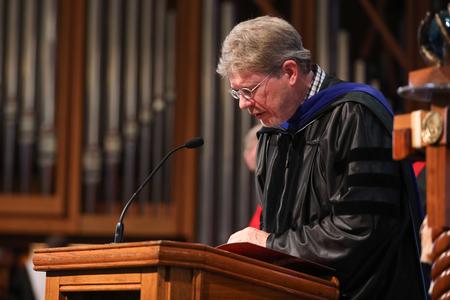 Mark Bolyard, university professor of biology and department chair and 2018 faculty member of the year, gives the invocation during summer graduation. - Photo by Kristi McMurry Woody