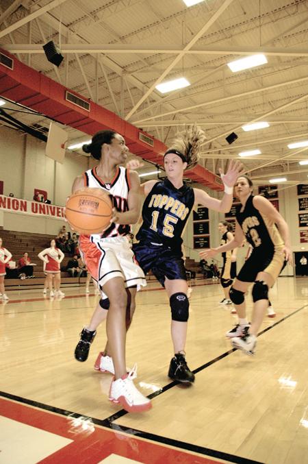 Senior guard Monica Elliot looks for help during a Union win over Blue Mountain. - Photo by Kathleen Murray