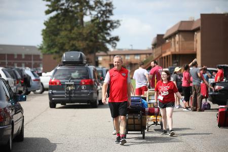 Dub Oliver, president of the university, helps new students move in during Welcome Week. - Photo by Kristi McMurry Woody