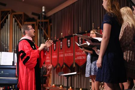 John Kinchen, professor of music and department chair, directs the Union University Singers during Fall Convocation. - Photo by Kristi McMurry Woody