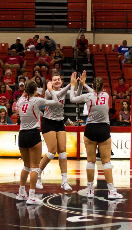 The Lady Bulldogs play a volleyball match against Belmont Abbey College in the Fred Delay Gymnasium. - Photo by Nikki Grim