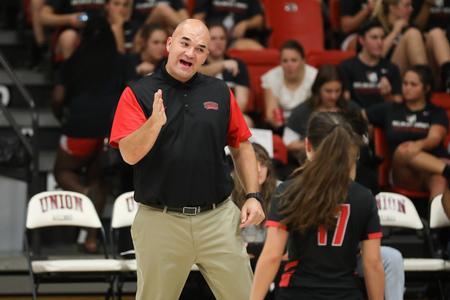 Darrin McClure, head volleyball coach, talks to one of his players during a game against Lane College.  - Photo by Kristi McMurry Woody