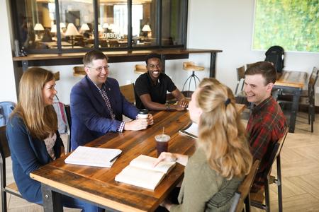 Ray Van Neste, dean of the school of theology and missions, talks with students in Modero. - Photo by Kristi McMurry Woody