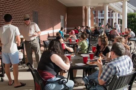 Faculty and students in the Department of Mathematics enjoy a pizza party on the Bowld Patio. - Photo by Lynn Tucker