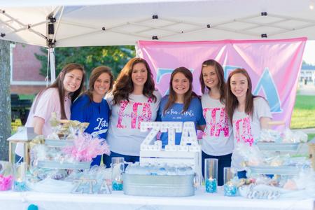 Members of Zeta Tau Alpha sell baked goods to benefit breast cancer awareness during Union Night. - Photo by Nikki Grim