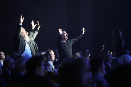 Guests of the 2018 Scholarship Banquet worship together while MercyMe performs. - Photo by Kristi McMurry Woody