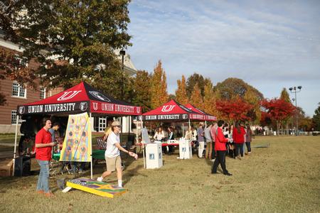 Homecoming guests enjoy the Forever Bulldogs event on the Great Lawn. - Photo by Kristi McMurry Woody