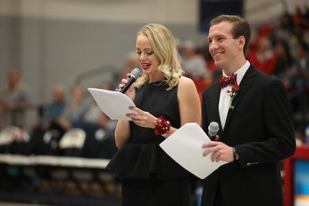 Miss and Mr. Union, Corinne Olund and Grant Allen, announce the Homecoming court during halftime. - Photo by Kristi McMurry Woody