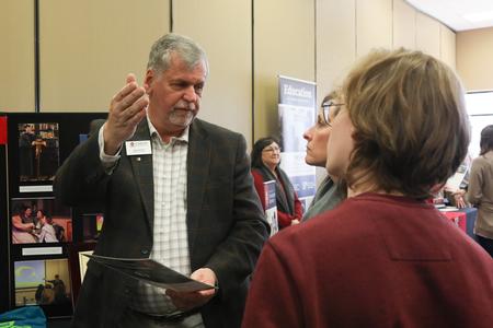 Ray Eaton, broadcasting technician, talks to a prospective student during Day at the U. - Photo by Sarah Palmer Goff