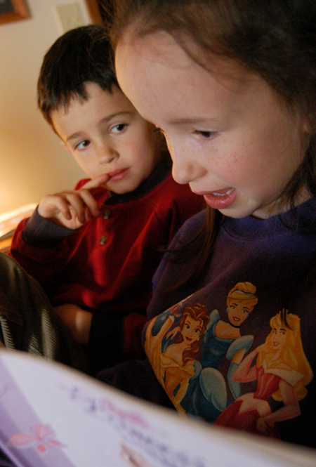 <i>Salazar Family C&C Profile</i> - Lillie reads a favorite story while her twin brother, Isaiah, looks on. - Photo by Kristen Nicole Sayres
