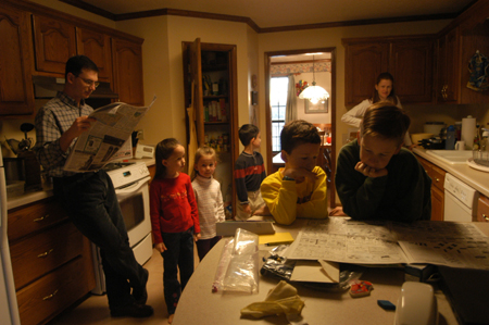 <i>Salazar Family C&C Profile</i> - The Salazar family gathers to catch up on the news before breakfast. - Photo by Kristen Nicole Sayres