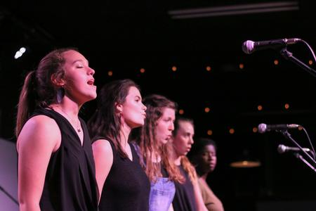 The group "Sisters" performs for Open Mic Night in Barefoots Joe. - Photo by Hannah Heckart
