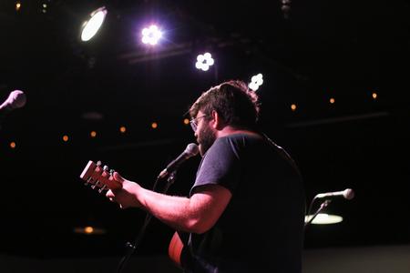Shea McCollough, English with honors major, performs during Open Mic Night in Barefoots Joe. - Photo by Hannah Heckart