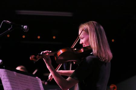 Joy Handley, music education major, performs during Open Mic Night in Barefoots Joe. - Photo by Hannah Heckart