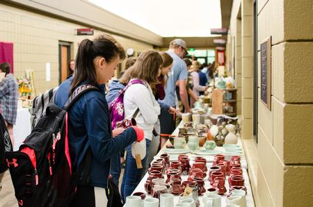 Students shop the annual Mother's Day Pottery Sale hosted by the art department. - Photo by Jess Newendyke