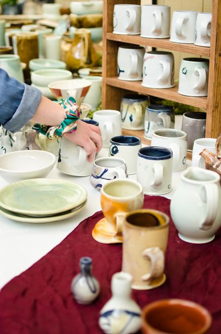 Art students sell their wares at the annual Mother's Day Pottery Sale. - Photo by Jess Newendyke