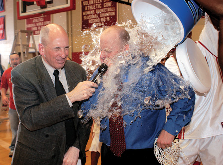 Bulldog head coach Ralph Turner and Steve Beverly, associate professor and interim chair of Communication Arts Departmennt, are soaked by players celebrating their TranSouth Conference Championship win. - Photo by Morris Abernathy