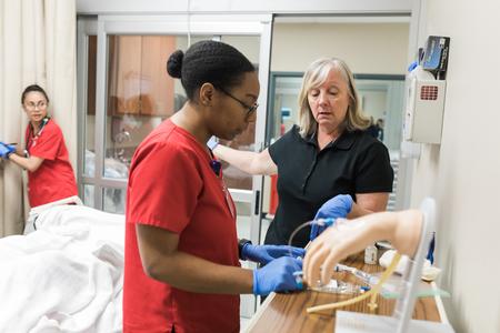 Jean Crawford, assistant professor of nursing, works with her students during a nursing simulation on the Germantown campus. - Photo by Kristi McMurry Woody