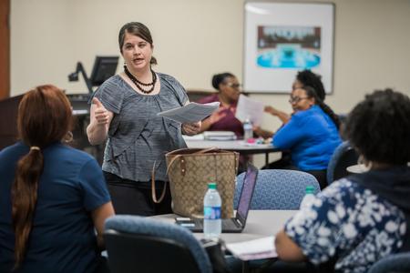 Rebecca Bohner, director of BSW programs, talks about an assignment with her students on the Germantown campus. - Photo by Kristi McMurry Woody