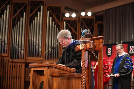Mark Bolyard, faculty member of the year, opens Awards Day chapel with prayer. - Photo by Kristi McMurry Woody