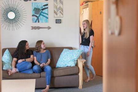 Macy Morrison, Morgan Ray and Callie Hauss, nursing majors, chat in their dorm room. - Photo by Kristi McMurry Woody