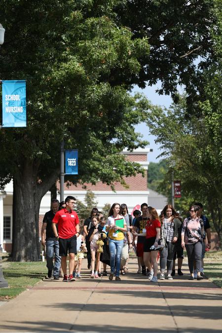 Prospective students and their families take a tour of campus during Homeschool Day at the U. - Photo by Kristi McMurry Woody