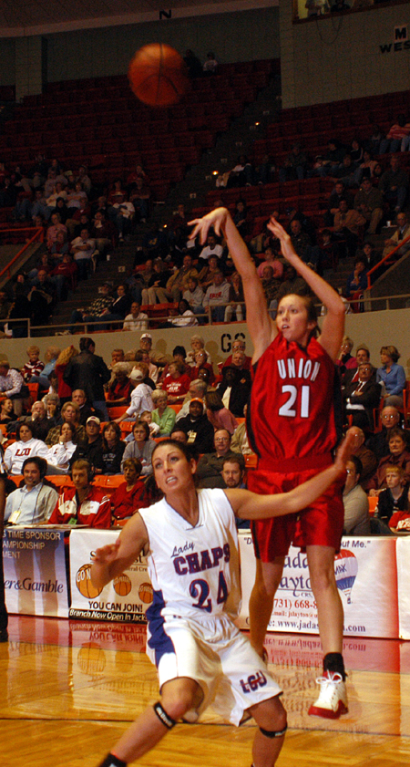 Junior guard Peggy McCain (21) takes a shot over a Lubbock Christian player during Union's 77-55 opening round win in the 2005 NAIA National Tournament. - Photo by Morris Abernathy