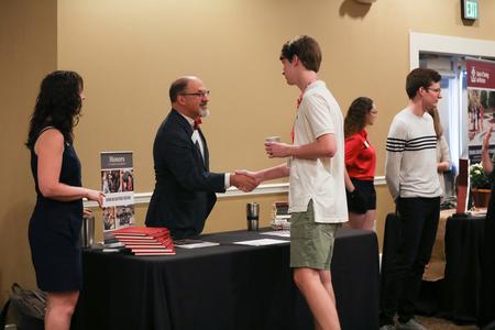 Scott Huelin, director for the honors community, talks to prospective students during Day at the U. - Photo by Kristi McMurry Woody