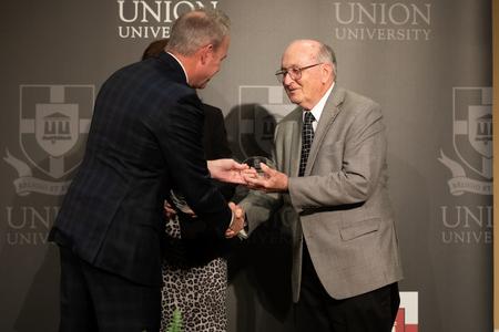 Bob Agee and his family receive the Union Family Legacy Award during homecoming. - Photo by Kristi McMurry Woody